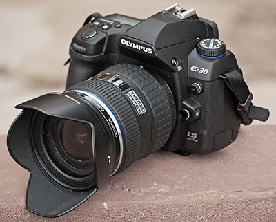 If you read this review about the Olympus E3 you will find that we liked it